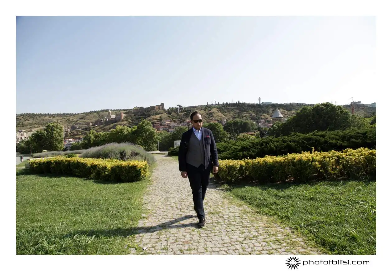Alessandro Sanna Phototbilisi photographer in Tbilisi A solo guy walking in europe square